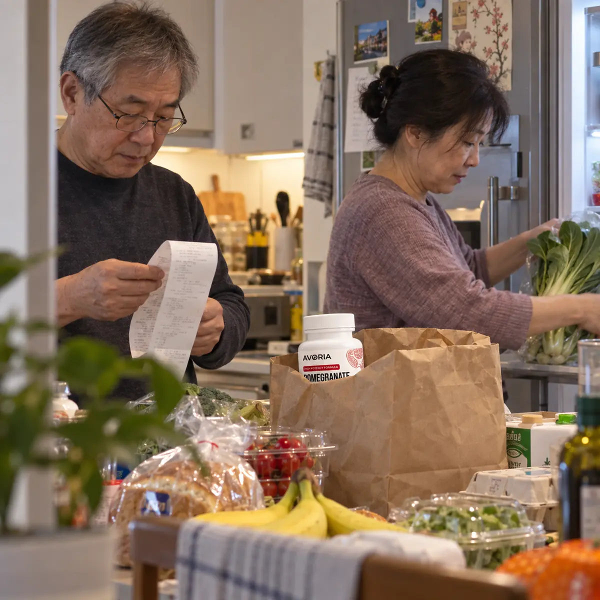 Couple casually unpacking groceries