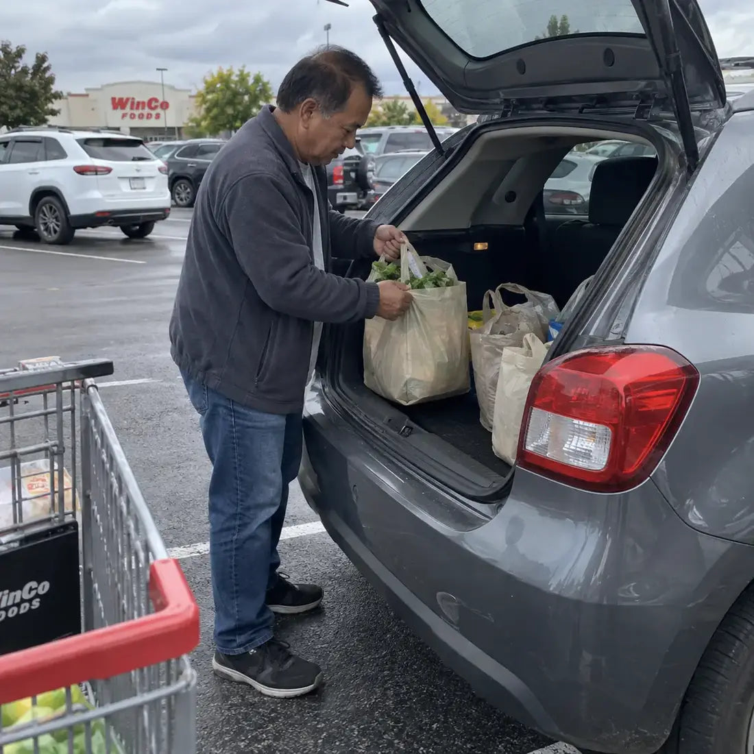 Man loading groceries into a car
