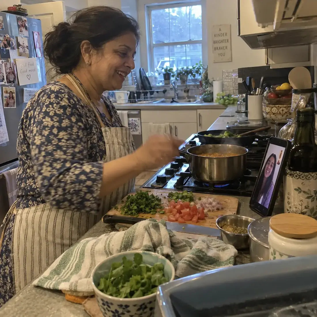 Woman cooking while talking with family