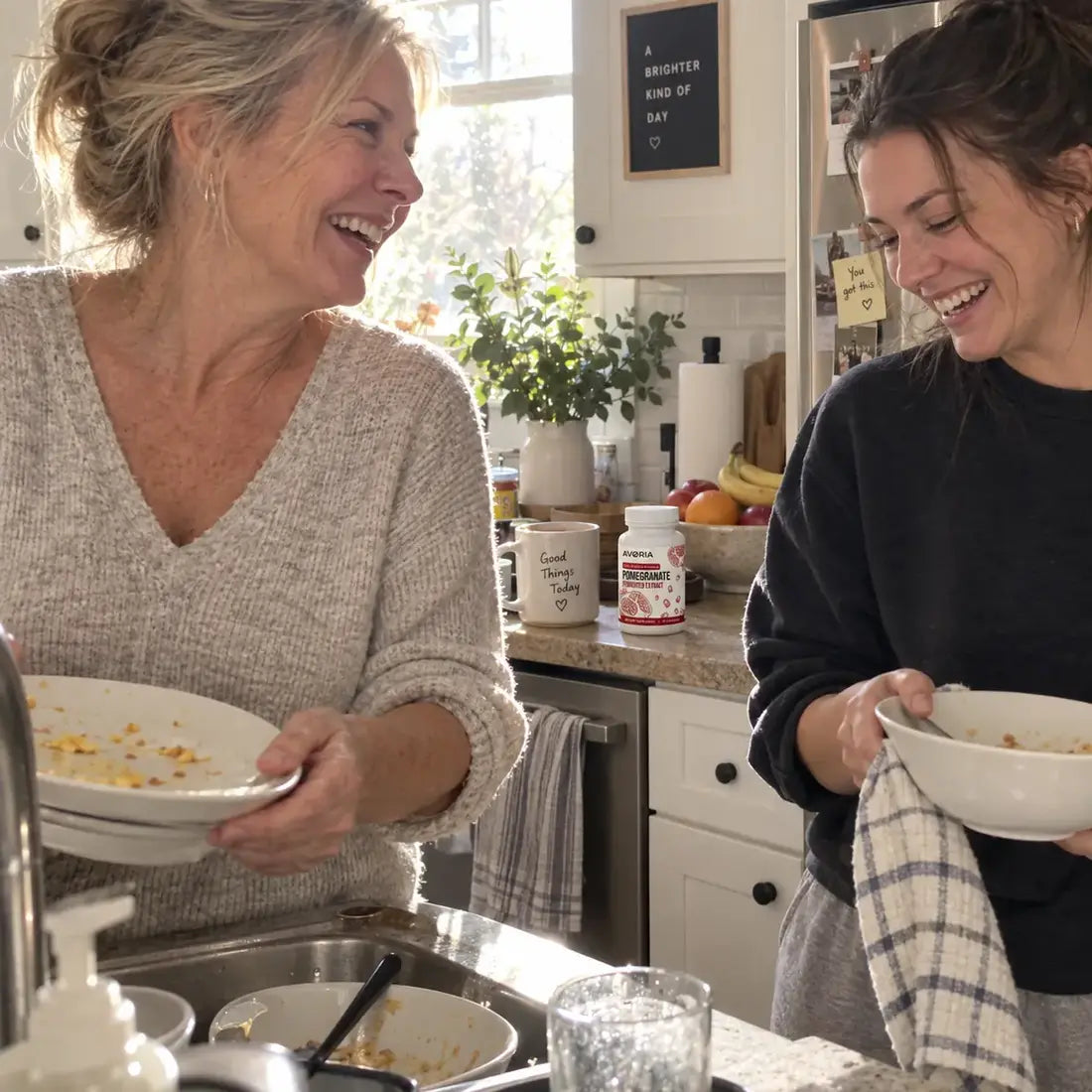 Family laughing while clearing breakfast